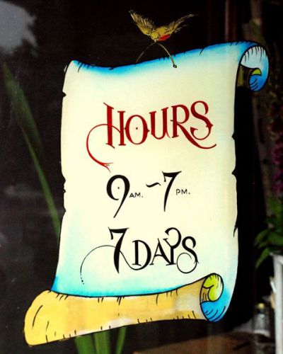 Image of custom/bespoke window signwriting project -  hand painted opening hours sign. A Day On Earth, Chapel Street, Prahran.